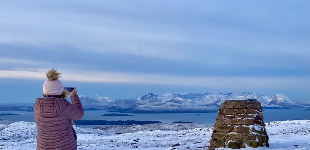 At the summit, viewing the Cuillins over on Skye